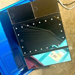 Battery operated lighted mirror